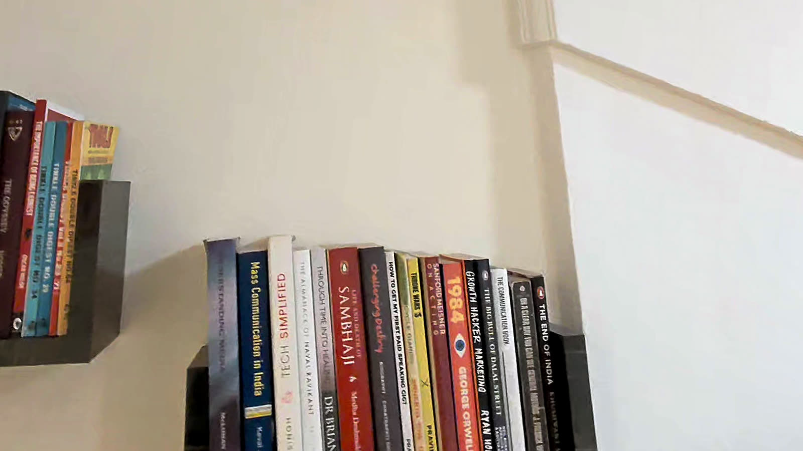 Books on corner shelves at Sylvaris.